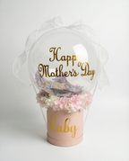 Pink box with flowers and 'Happy Mother's Day' message, featuring the name text, full product view