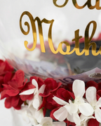 Clear Dome with 'Happy Mother's Day' in gold letters, surrounded by red and white flowers.