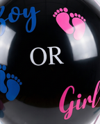 Black balloon with 'Boy' and 'Girl' text and footprints, text close up