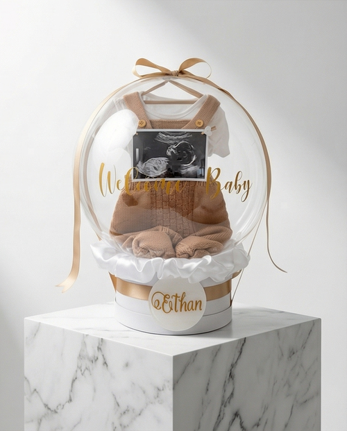 Baby shower gift with baby onesie, socks, and ultrasound photo inside a decorative box, full product view