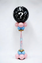 Black balloon with question marks and colorful base, full view