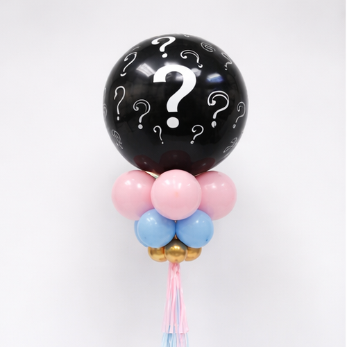 Black balloon with question marks and colorful base, close up balloon