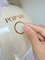 Decorative balloon with 'POP ME'