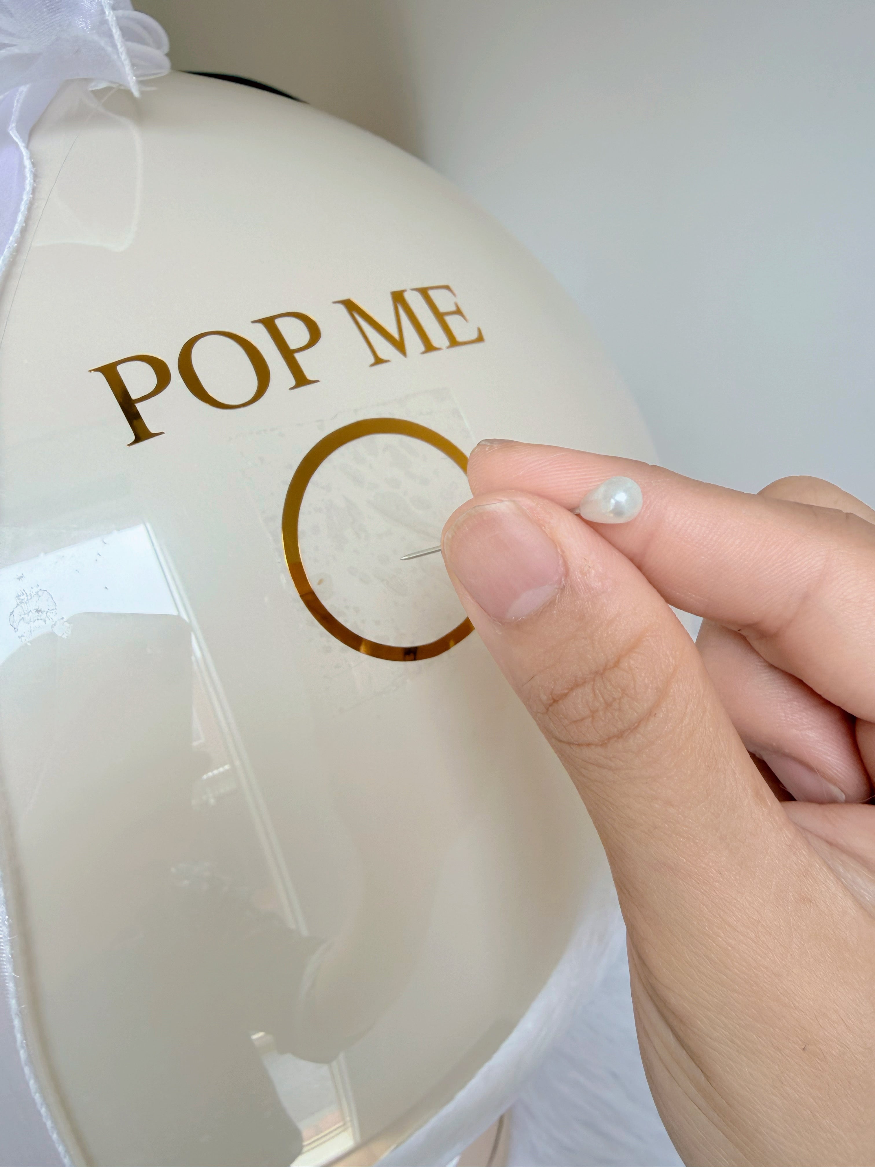 Decorative balloon with 'POP ME'